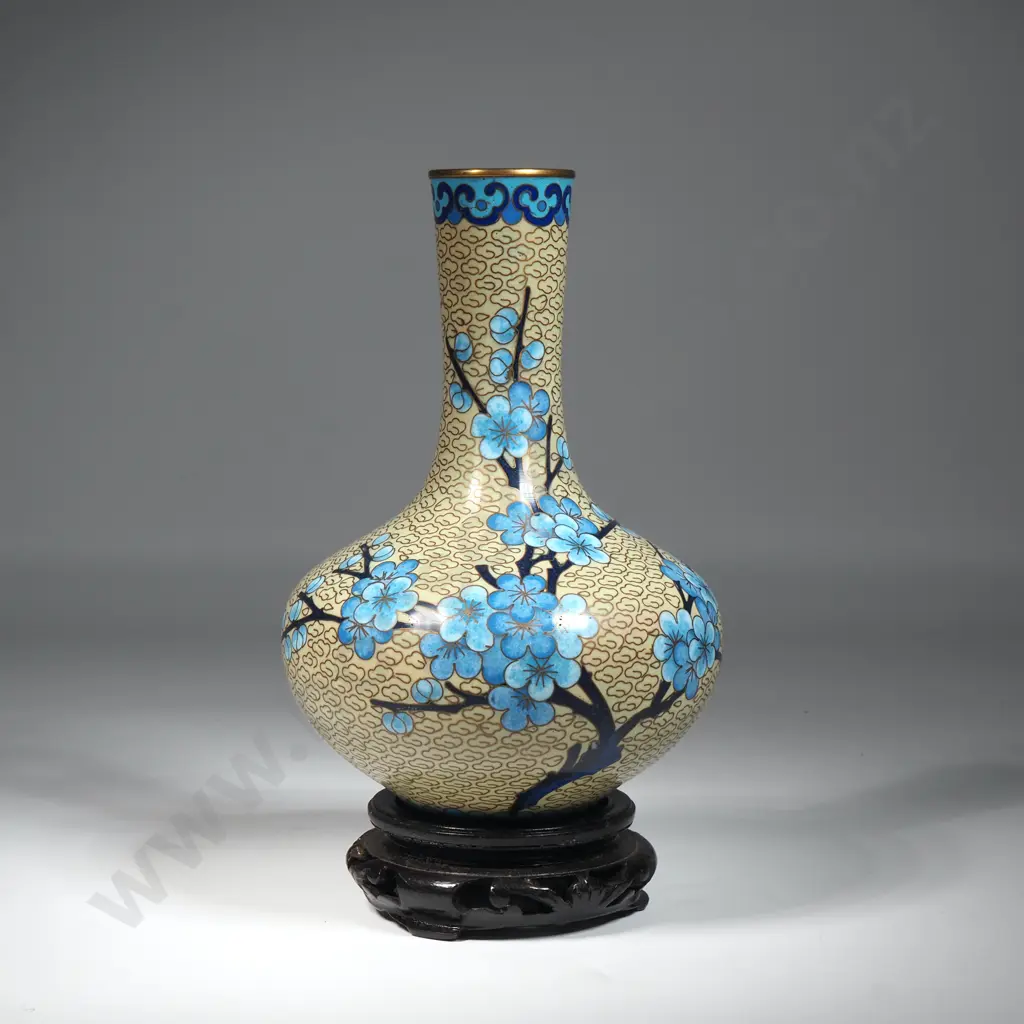 Chinese Cloisonne Vase. Cream Ground  Decorated with Blue Apple Blossom On A Carved Wooden Base. Image 1++