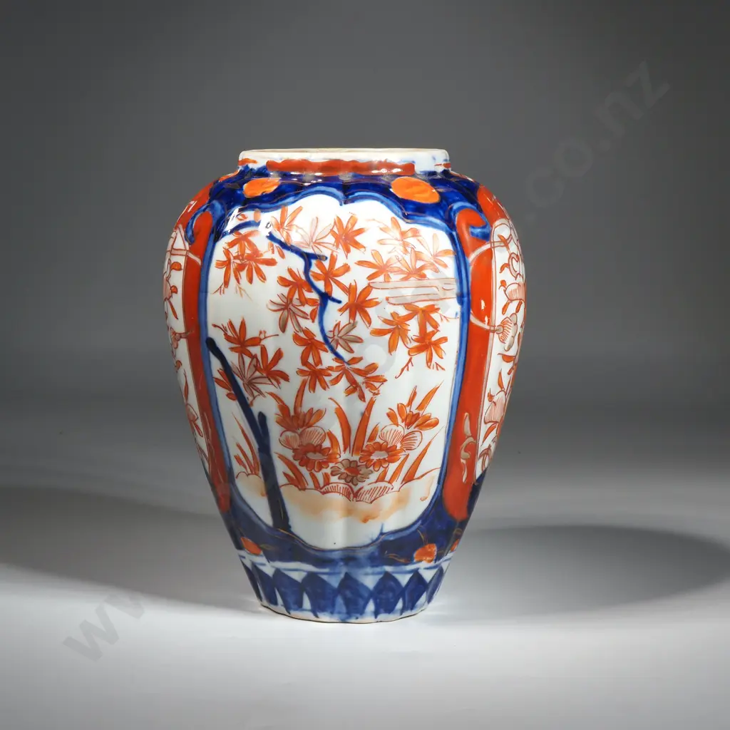 Japanese Imari Vase Decorated With Four Cartouche Featuring Floral Scenes & In Traditional Blues & Iron Red Colours Image 1++