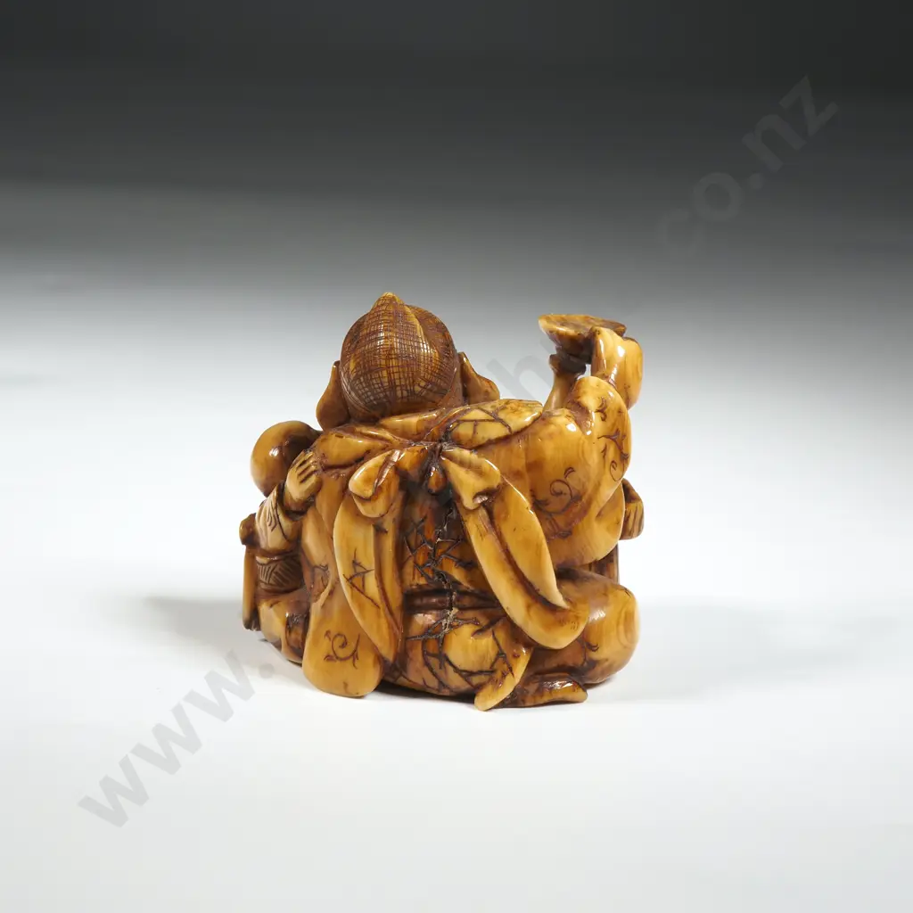 Ivory Netsuke Of a Figural Group. Image 1++