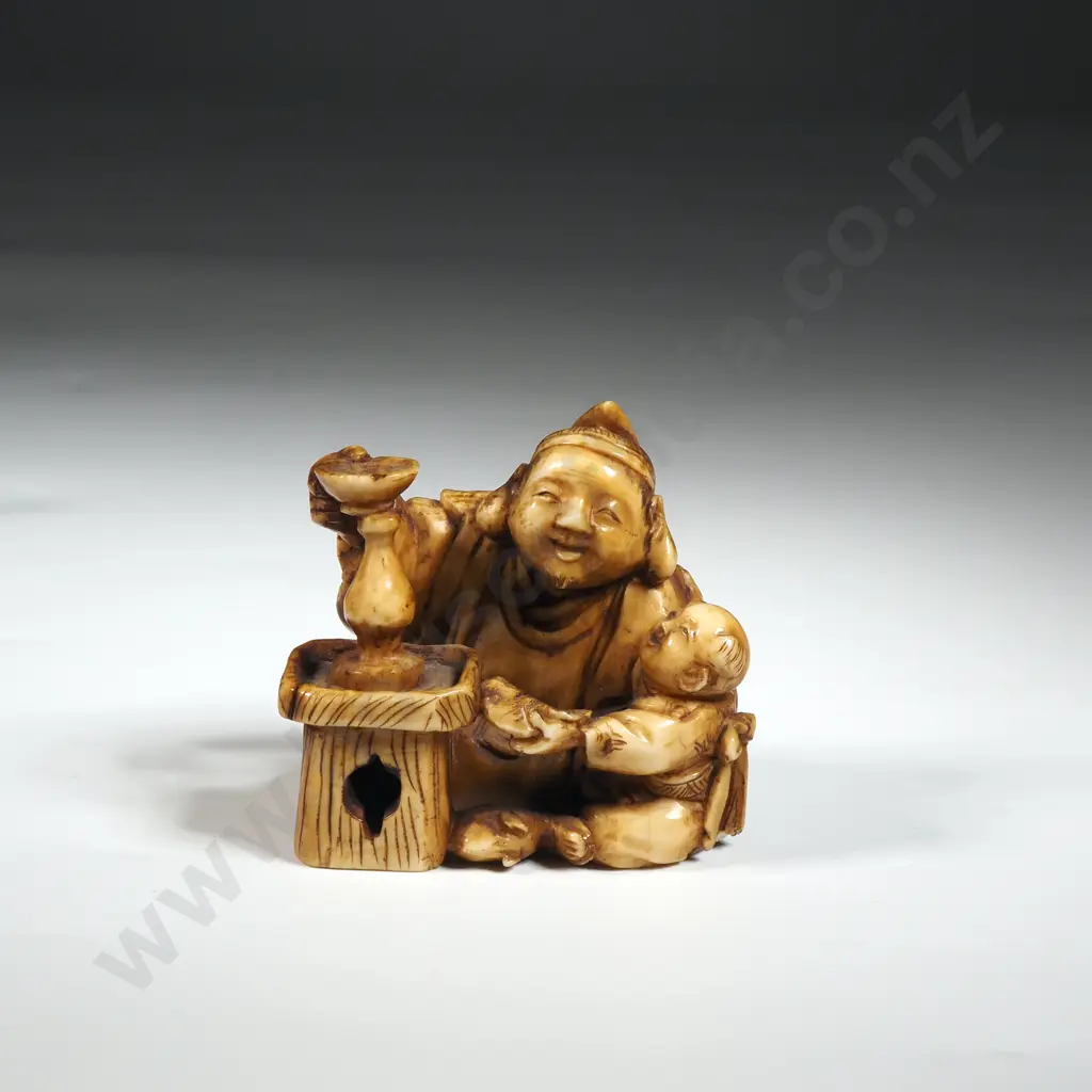 Ivory Netsuke Of a Figural Group. Image 1++