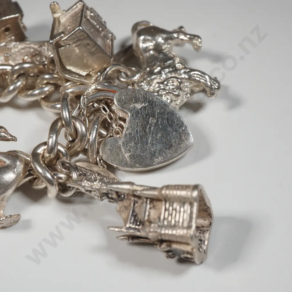 Exceptional Sterling Silver Charm Bracelet w 18 Charms incl Moari Whare Image 1++