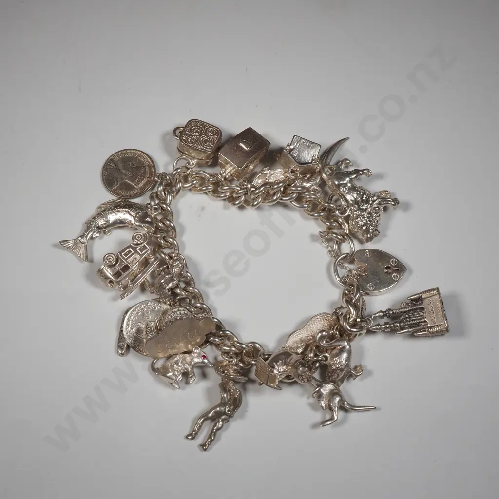 Exceptional Sterling Silver Charm Bracelet w 18 Charms incl Moari Whare Image 1++