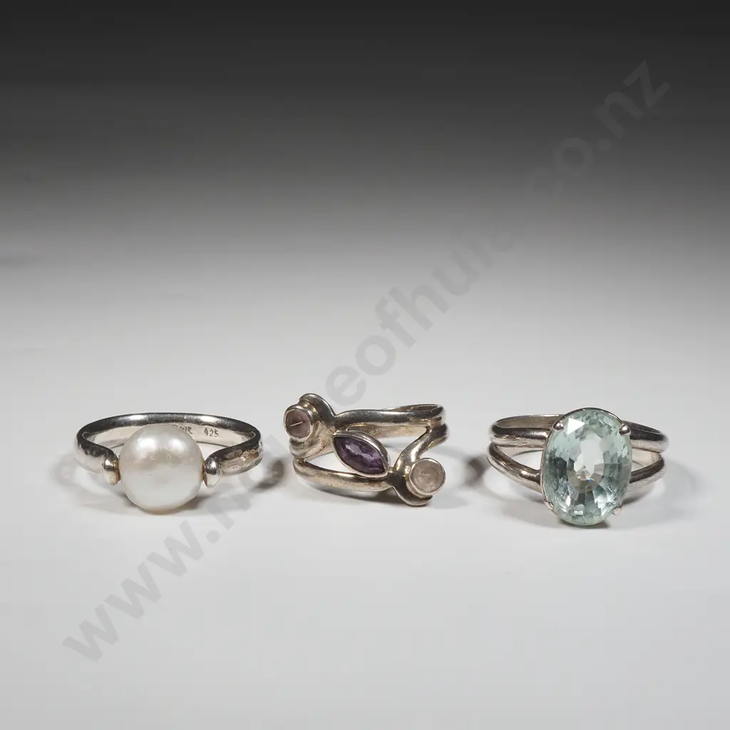 Three Sterling Silver Rings - One Set With Aquamarine Coloured Stone,One Suspended With A Pearl & The Third w Amethysts Image 1++