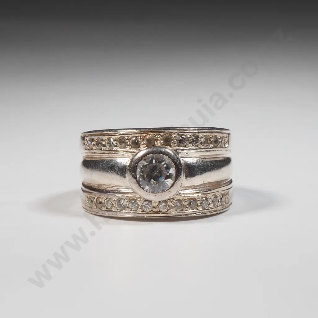 Sterling Silver Ring Flanked by White Stone & Set With Central Solitaire Stone Image 1++