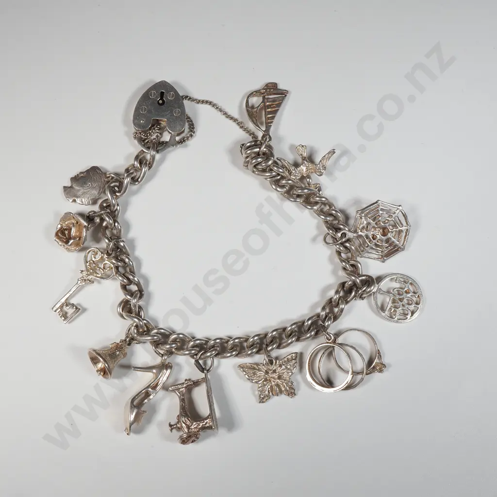 Vintage Sterling Silver Charm Bracelet with A Variety Of Charms Including A Sewing Machine, Spider's Web,Engagement Ring Image 1++