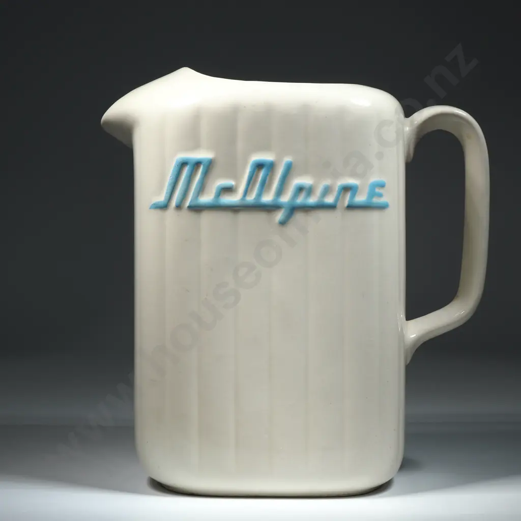 A Crown Lynn White McAlpine Refrigerator Jug. Ribbed rectangular section form with 'McAlpine' w Blue Highlighted Letters Image 1++