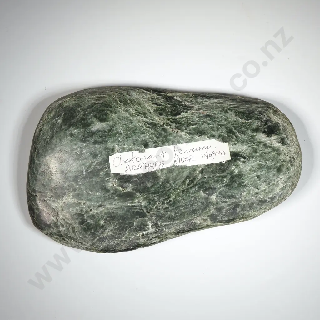 Chatoyant  Pounamu  Arahura Riverstone Displaying A Shimmery Cat's Eye Effect. Image 1++
