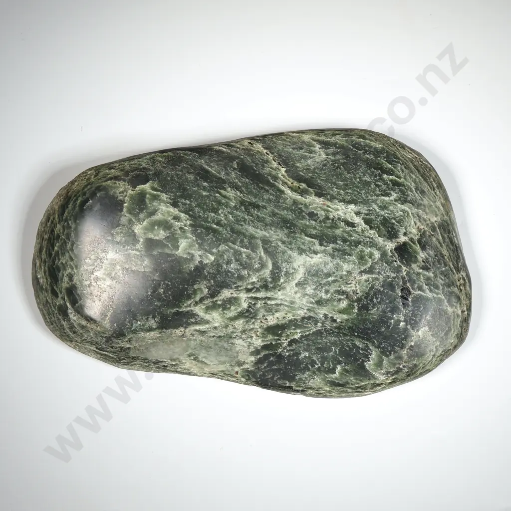 Chatoyant  Pounamu  Arahura Riverstone Displaying A Shimmery Cat's Eye Effect. Image 1++
