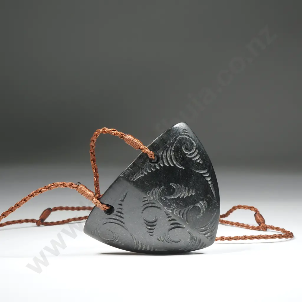 Pounamu Breastplate with Whakairo Designs On A Brown Plaited Cord Image 1++