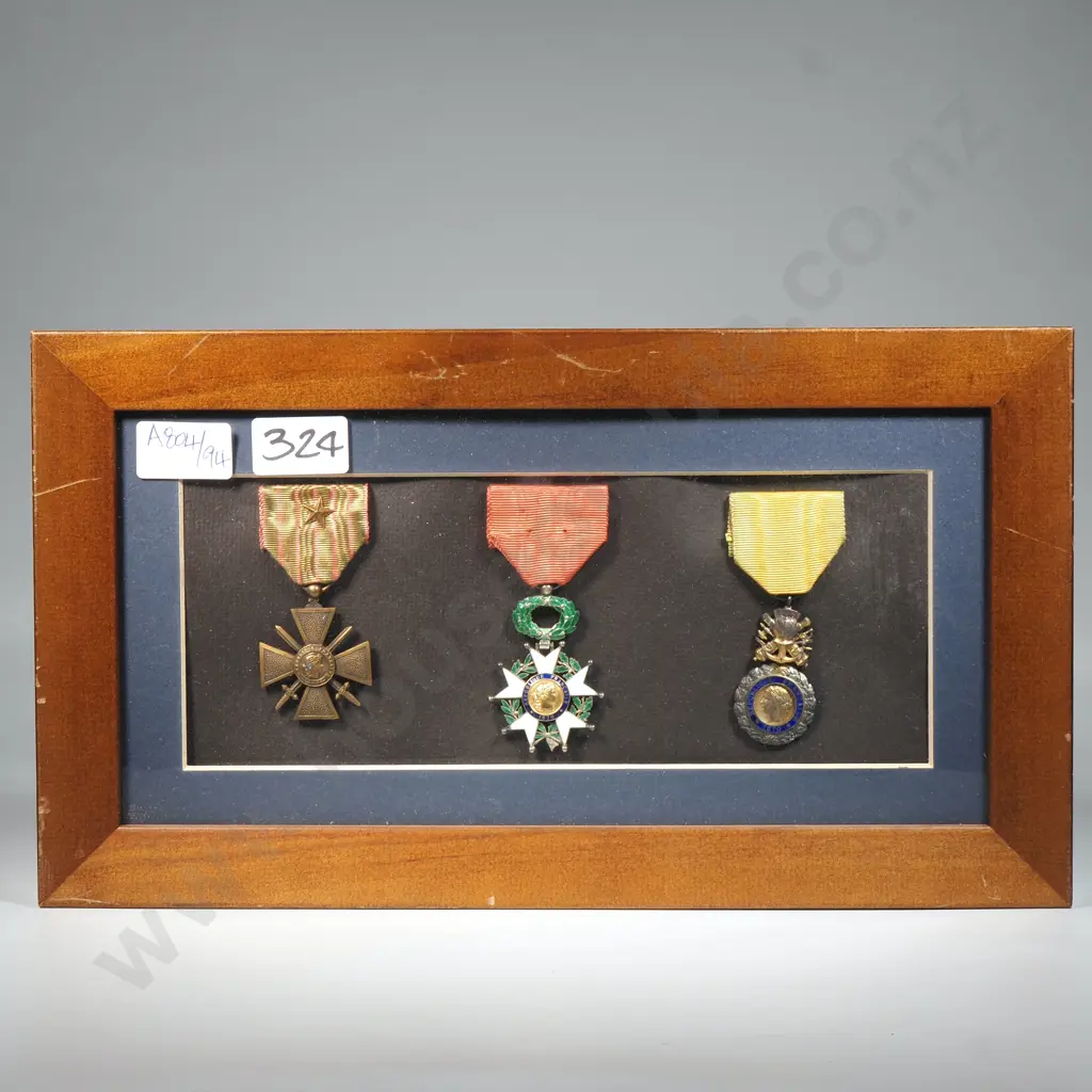 Three WW2 French Military Medals in Wooden Frame Image 1++