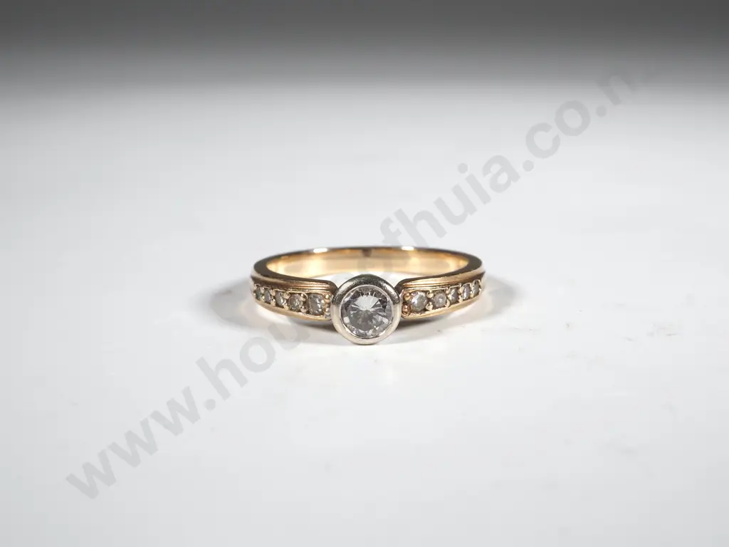 9ct Gold & Diamond Ring. Central Diamond Flanked By Shoulder Diamonds Image 1++