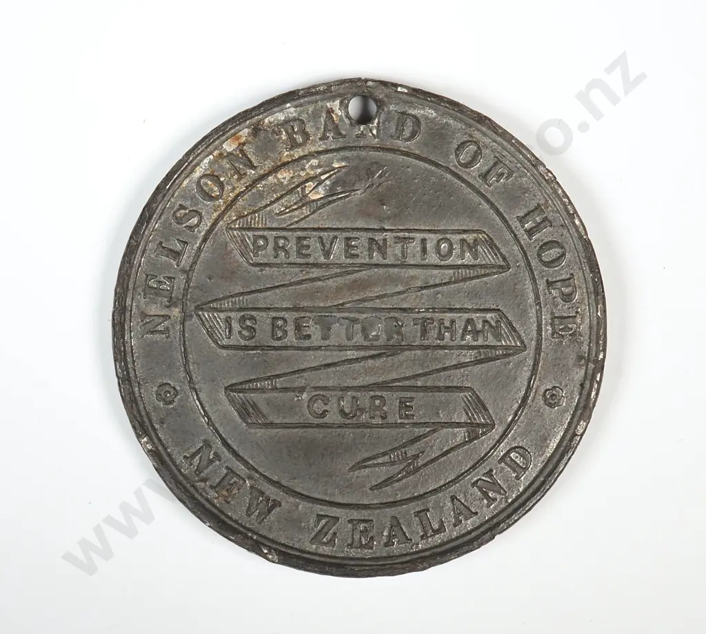 White metal medal struck for the Nelson Band of Hope, New Zealand, undated. 38mm. It is listed in the Medallic Commemoratives of New Zealand 1865-1940 by Leon Morel as number A/3  ( Auckland, NOT Nelson ) and has a rarity rating of R5 ( rare ) Image 1++