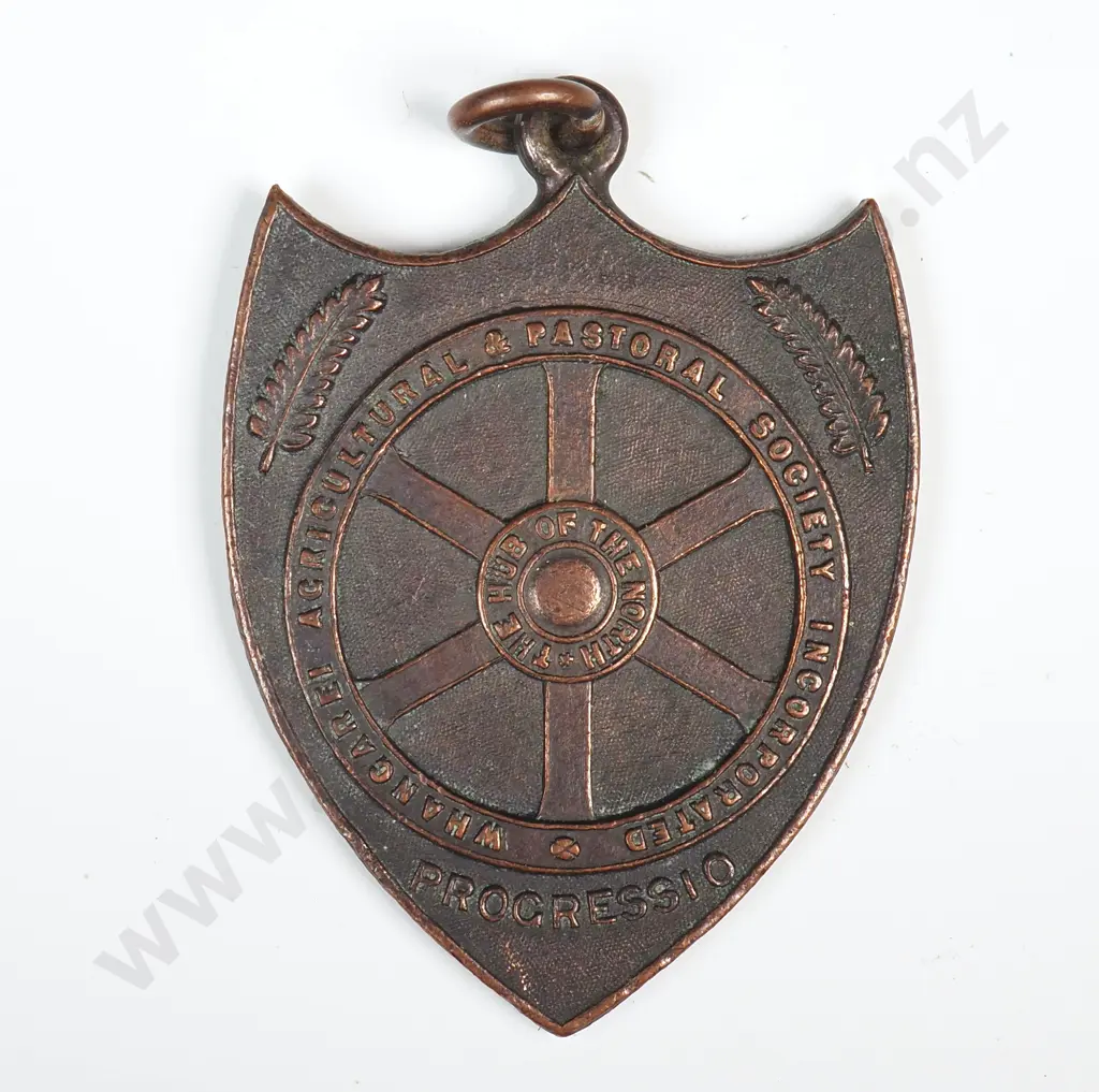Copper prize fob medal, on the front “WHANGAREI AGRICULTURAL & PASTORAL SOCIETY INCORPORATED”, ‘PROGRESSIO” and “THE HUB OF THE NORTH”, the back engraved “V. R. DROVER / 1947” Image 1++