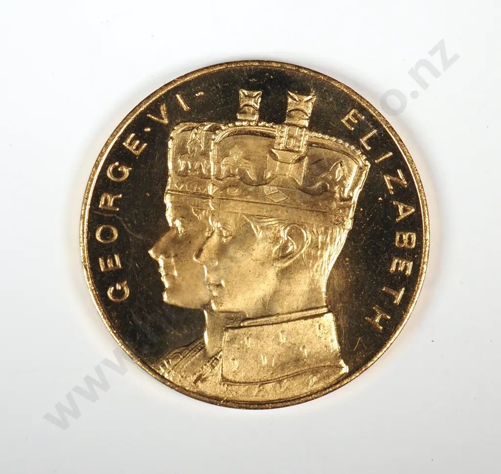 Gilt medal struck  to commemorate the proposed Royal visit of King George VI and Queen Elizabeth in 1949. 35mm. It is listed in the Catalogue of New Zealand Commemorative Medals 1941-2007 by Hamish MacMaster as number 1949/3 and is very rare Image 1++