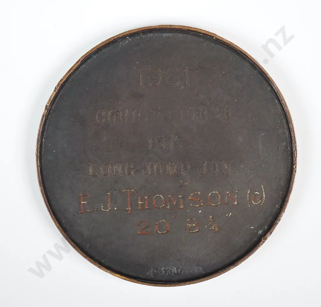 Copper medal “NZAAA / N.Z. AMATEUR CHAMPIONSHIP”, engraved “1961 / CHRISTCHURCH / 1ST / LONG JUMP / E. J. THOMSON (0) / 20’ 8 ¼ “”, 40mm Image 1++