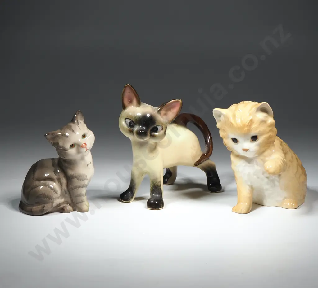 Three Porcelain Cat Figurines Image 1++