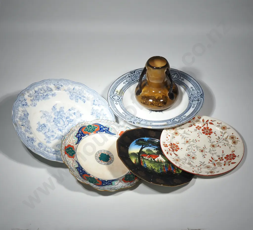 A Collection of Plates and a Vase Image 1++