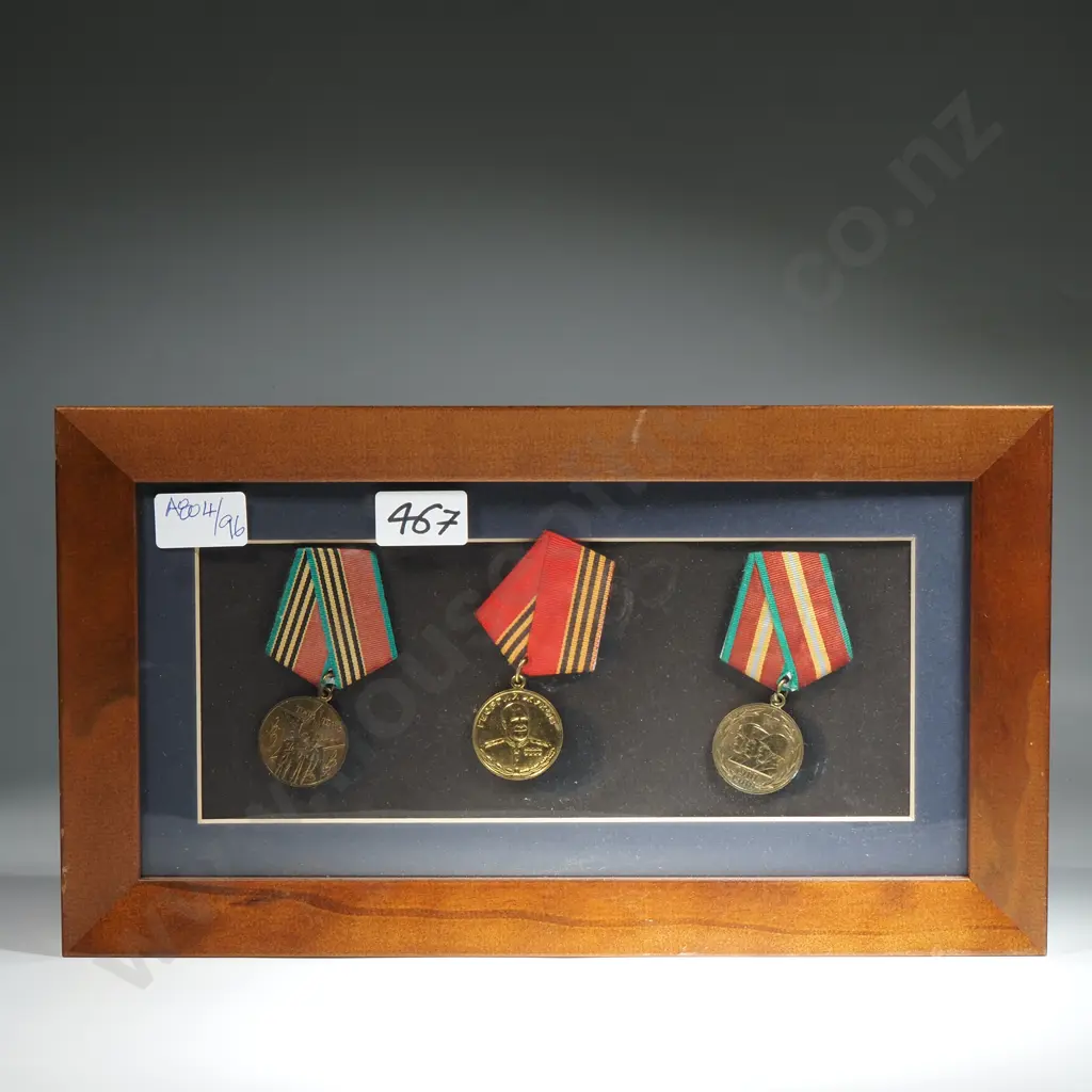 Three Soviet Medals in Wooden Frame Image 1++