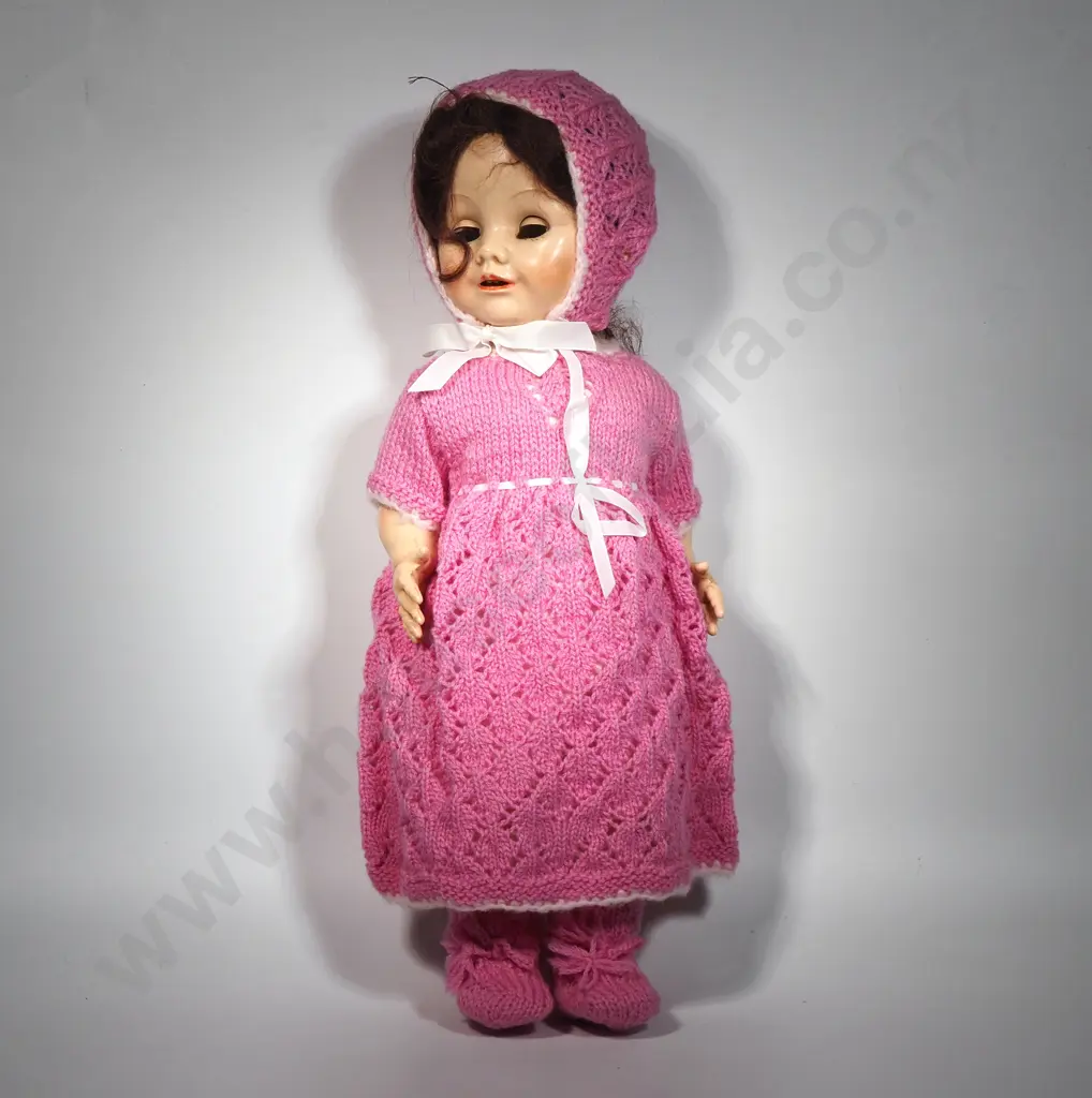 Vintage Porcelain Doll Featuring Pink Knitted Garments Including Booties & Bonnet Image 1++