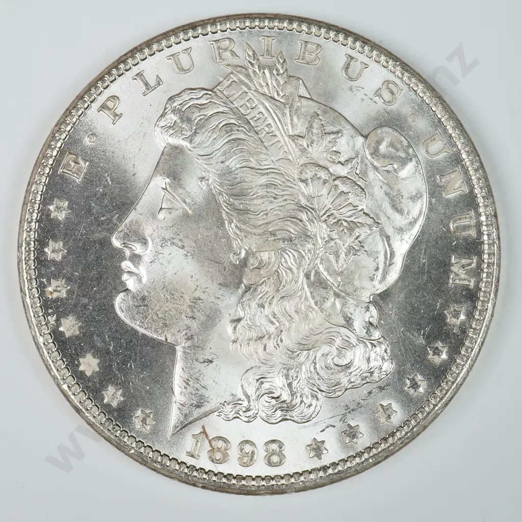 Morgan Dollar: 1898 O - MS60 C.V USD $116 ( NZD $200 ) MS65 C.V USD $308 ( NZD $535 ) Image 1++