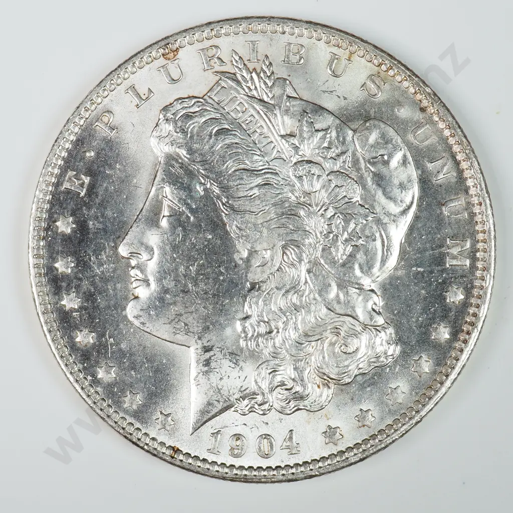 Morgan Dollar: 1904 O - MS60 C.V USD $116 ( NZD $200 ) MS65 C.V USD $312 ( NZD $540 ) Image 1++