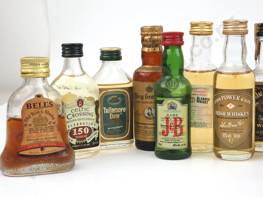 Quantity Of Miniature Whiskey/ Whisky Bottles Including a Miniature Wade Bells Scotch Whisky Decanter In A  Bell Shape Image 1++