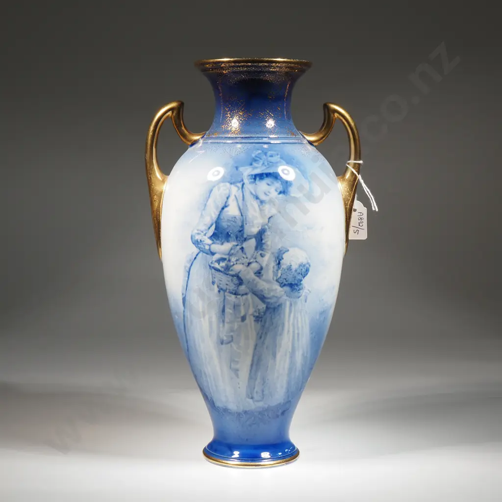 Royal Doulton Blue Children’s Vase w Gilt Handles Depicting A Child Rummaging Through Mother's Basket w Daffodils Verso Image 1++