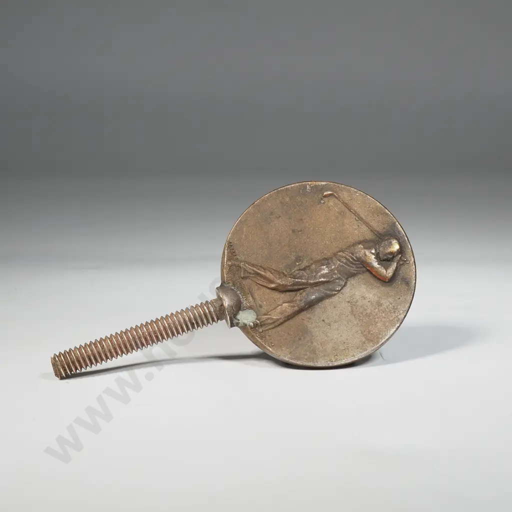 Metal Medallion Featuring An Embossed Figure Of A Golfer  Image 1++