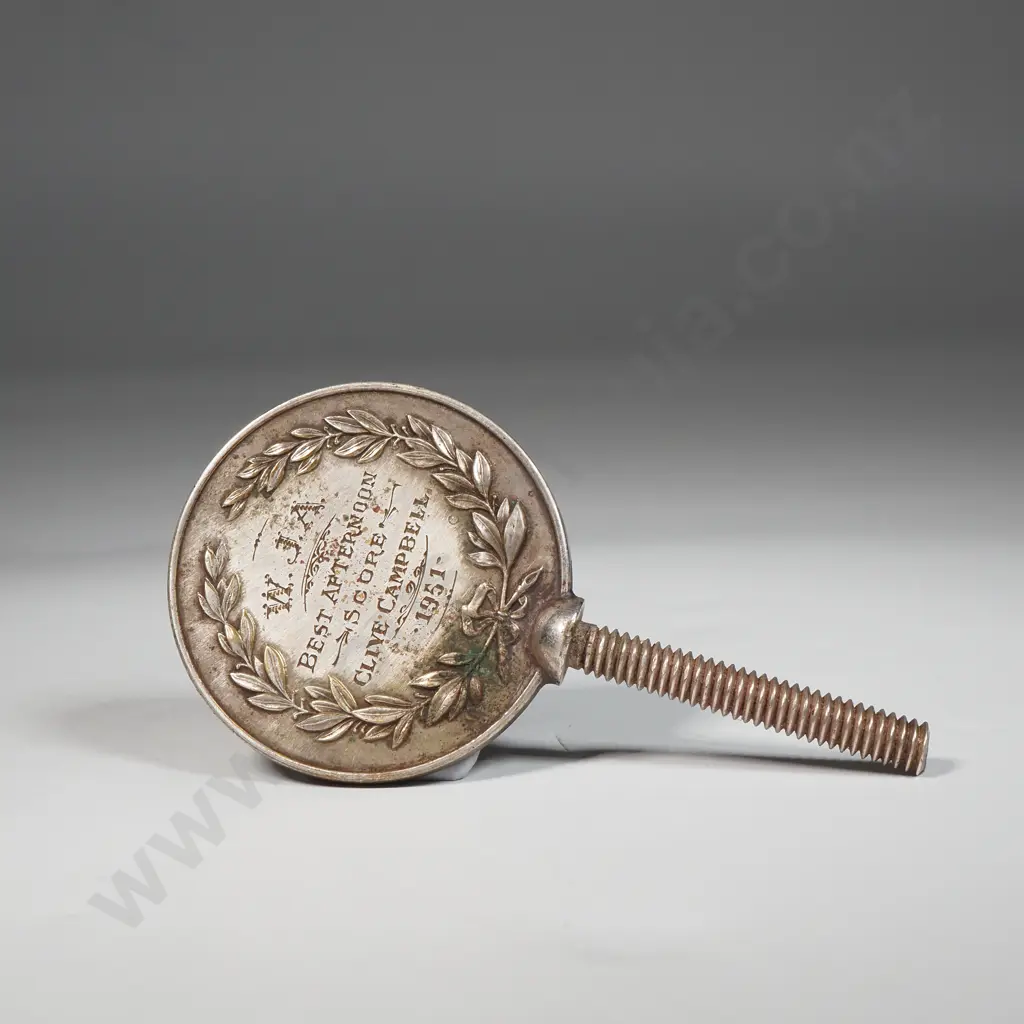 Metal Medallion Featuring An Embossed Figure Of A Golfer  Image 1++