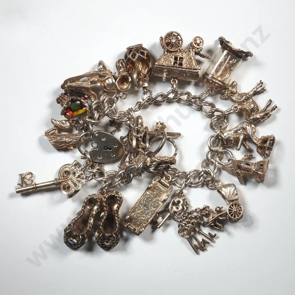 Antique Sterling Silver Charm Bracelet w Heart Locket & Nineteen Charms. Image 1++