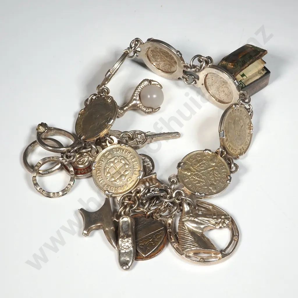 Charm Bracelet Comprised of  Seven Silver Threepence Coins & Nine Charms. Image 1++