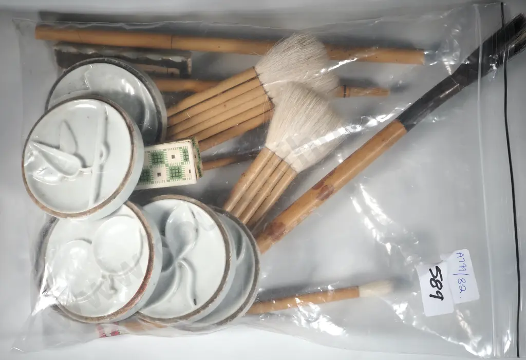 Assorted Lot of Chinese Paint Brushes, Paint Brush Rest, Six Chinese Porcelain Paint Palettes & Four Ivory Chops. Image 1++